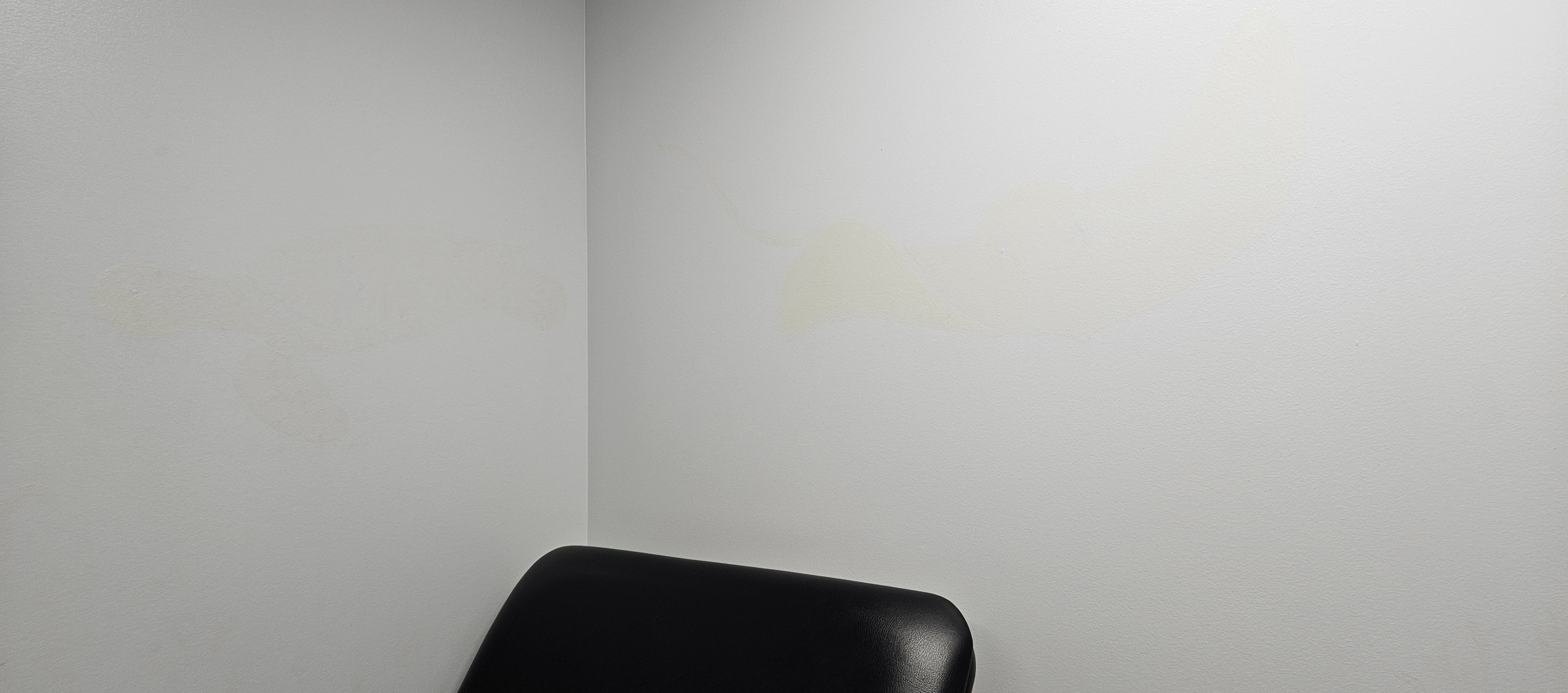 Ocean room in normal light before black light art transformation