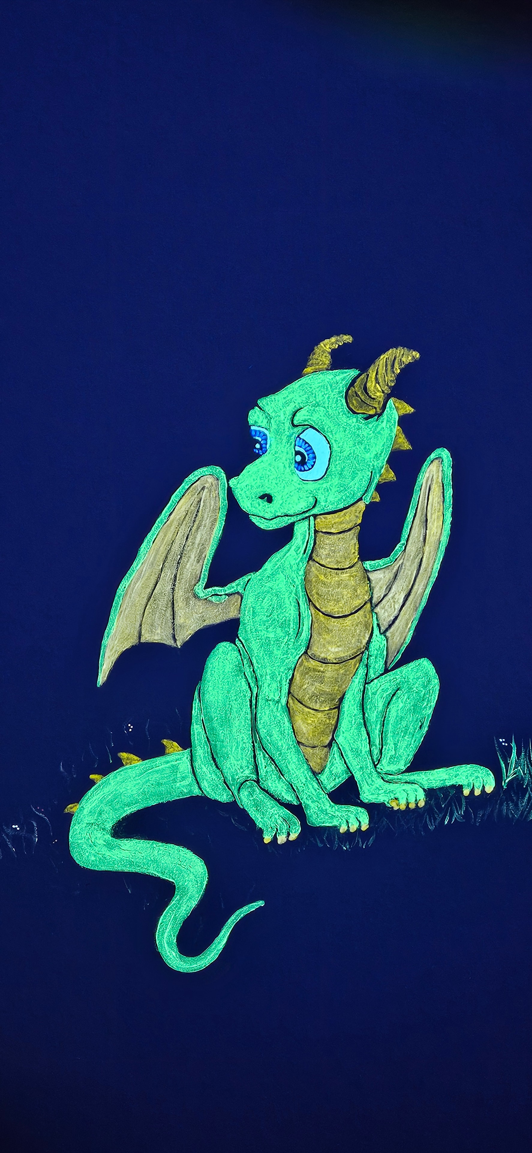 Glowing teal green dragon climbing a vine under black light in the Fantasy Room