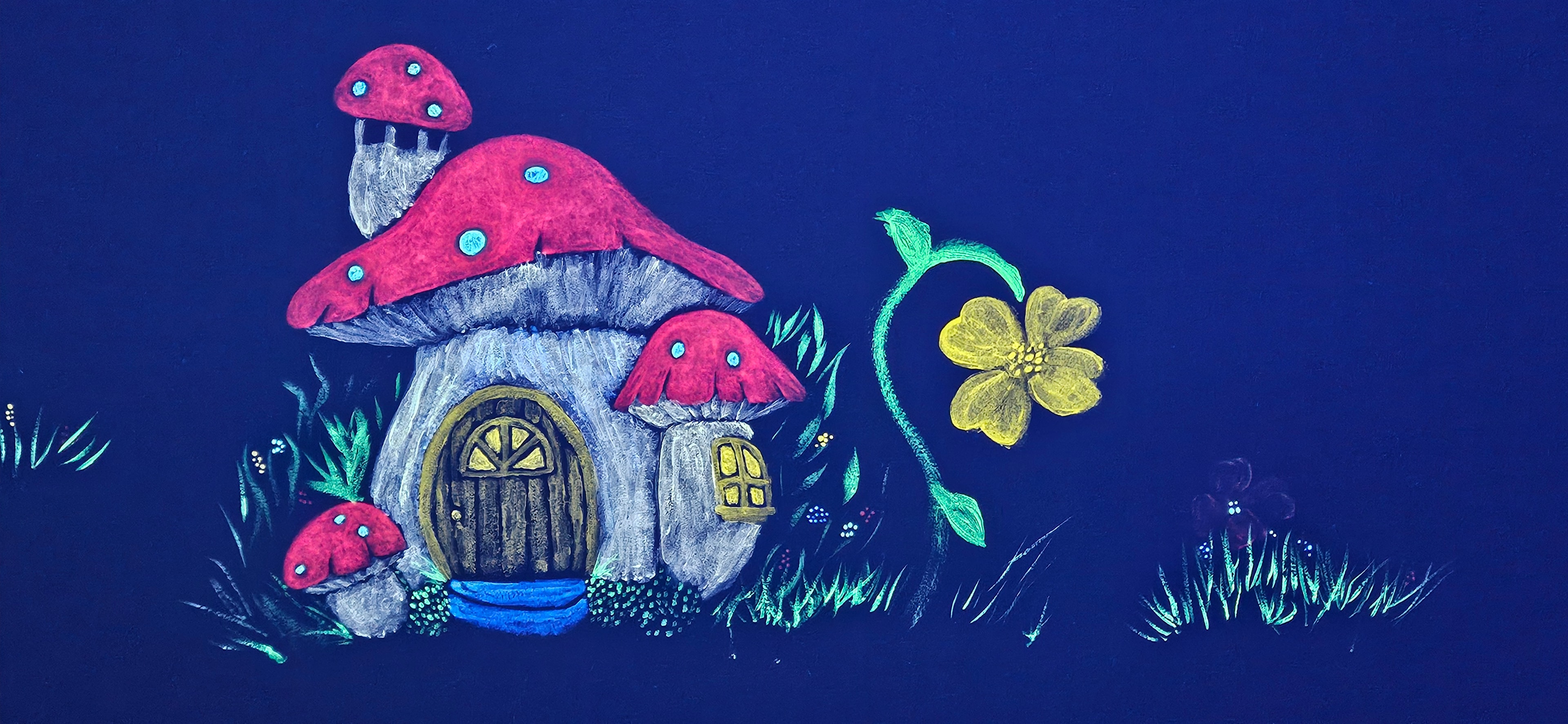 Glowing red mushroom fairy house with a round door and yellow flower under black light in the Fantasy Room