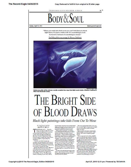 Traverse City Record-Eagle article — Black light paintings take kids From Ow To Wow, featuring the orca mural